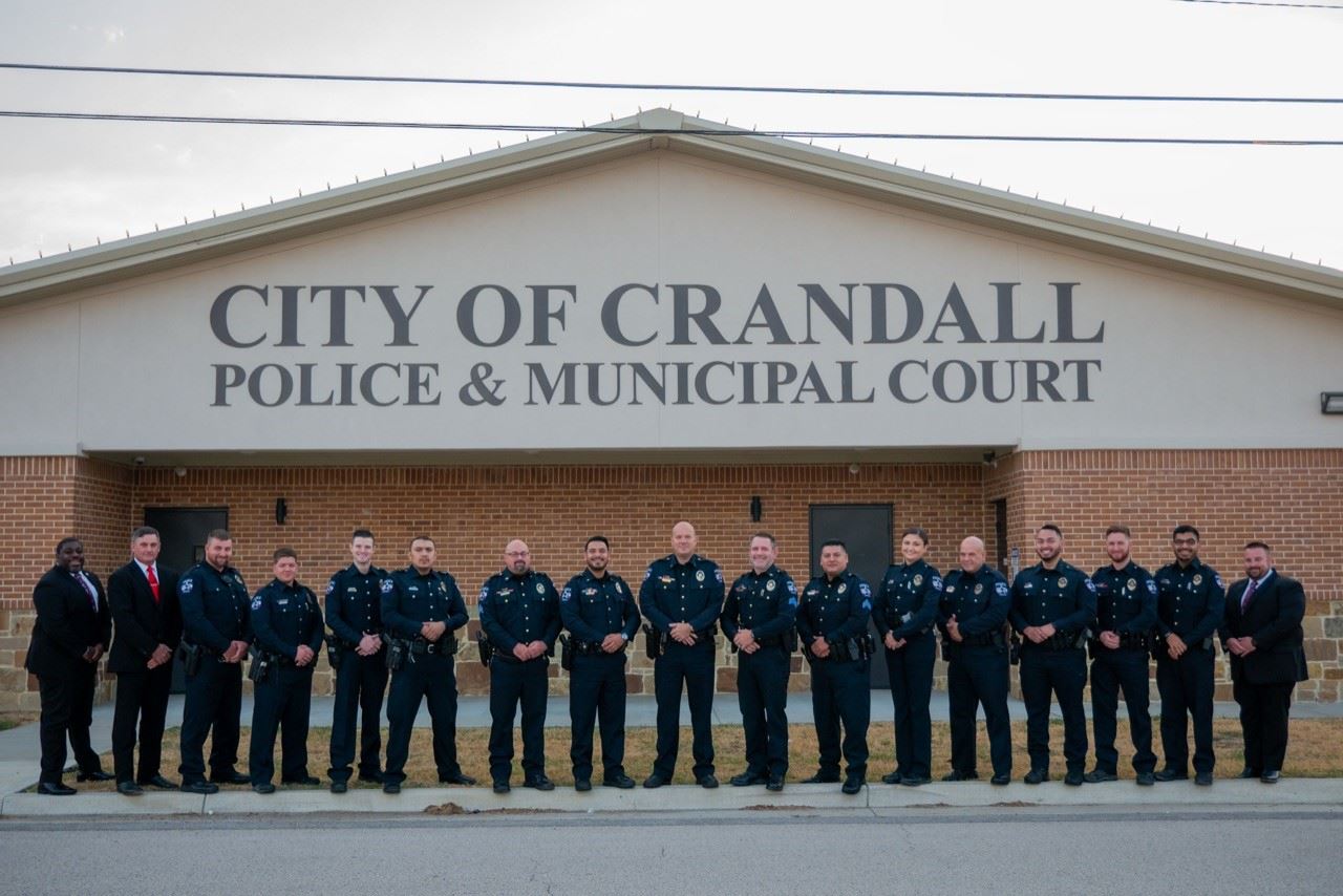Crandall Police Department standing in front of Police Department