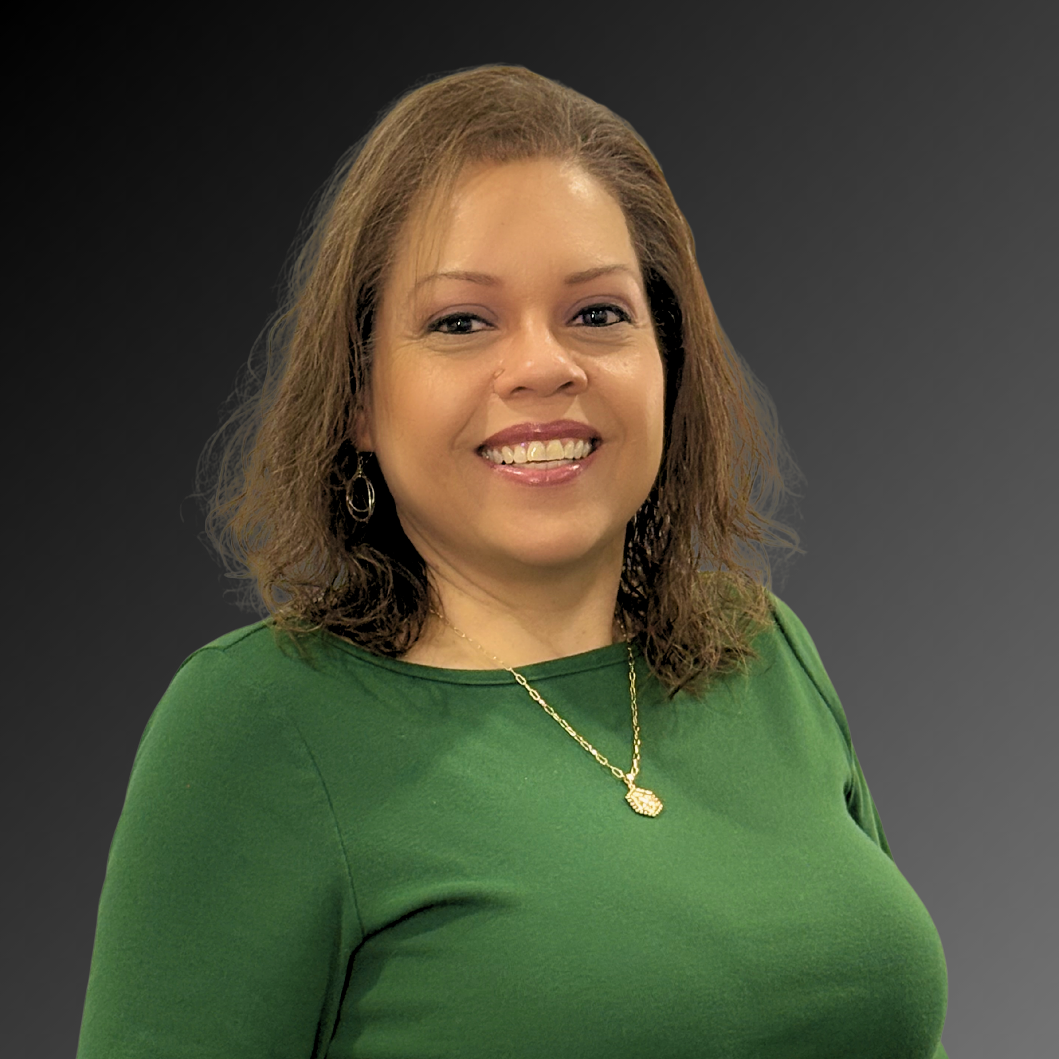 Professional headshot image Amanda Brown in green blouse, dark background