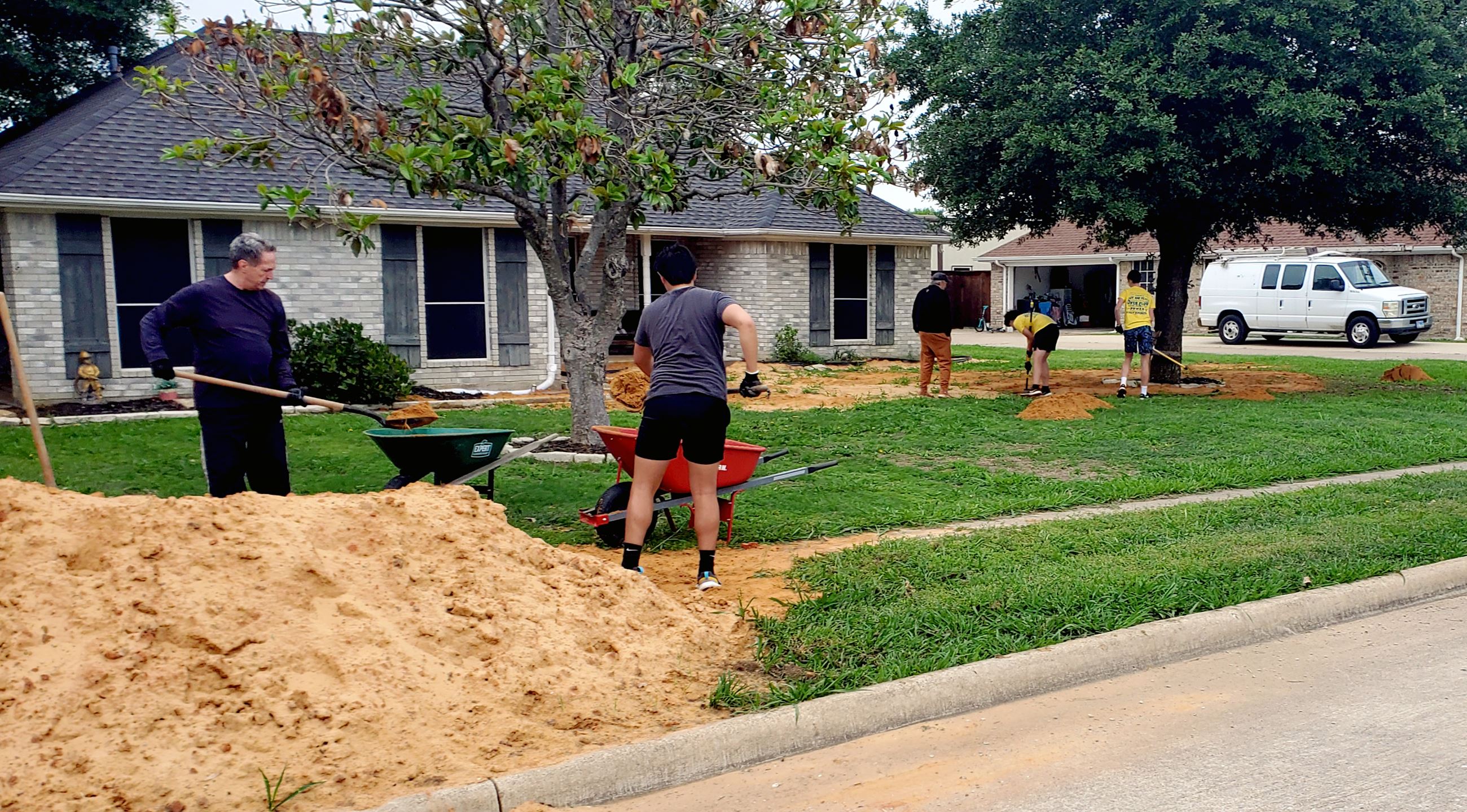 The Gathering Church and Grace Homeschool Co-op work on yard work