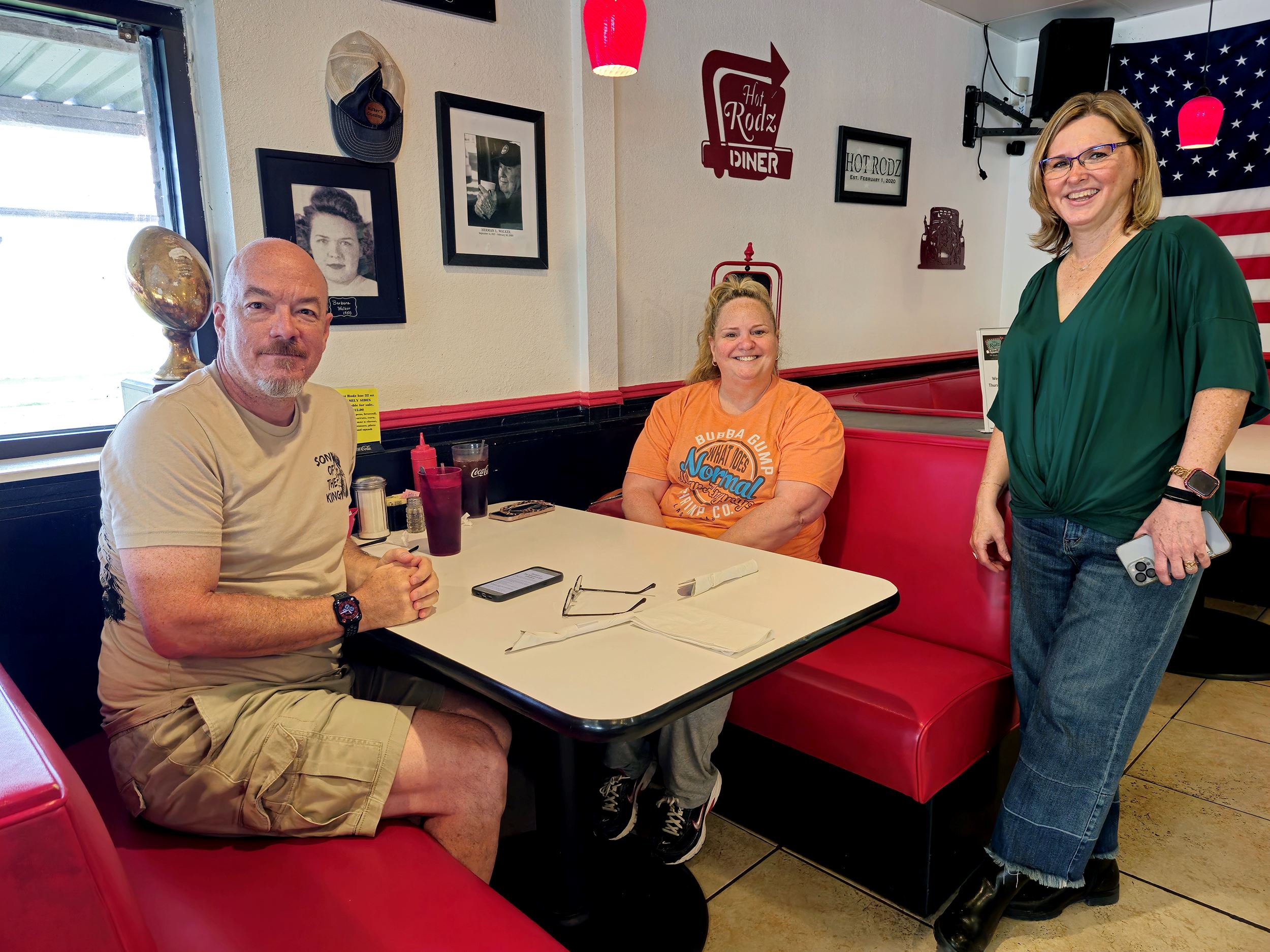 Happy customers pose for a picture with Kathy at Hot Rodz Diner