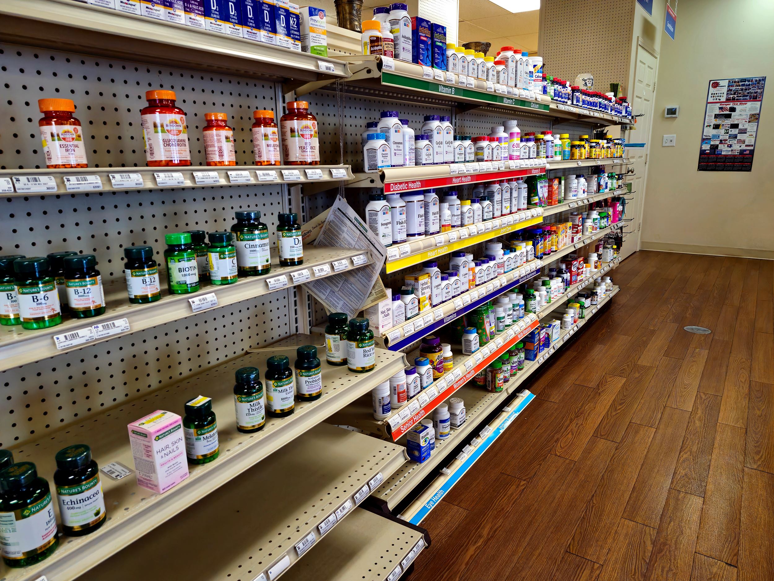 Rows of medications, including cold medicines, at Crandall Pharmacy