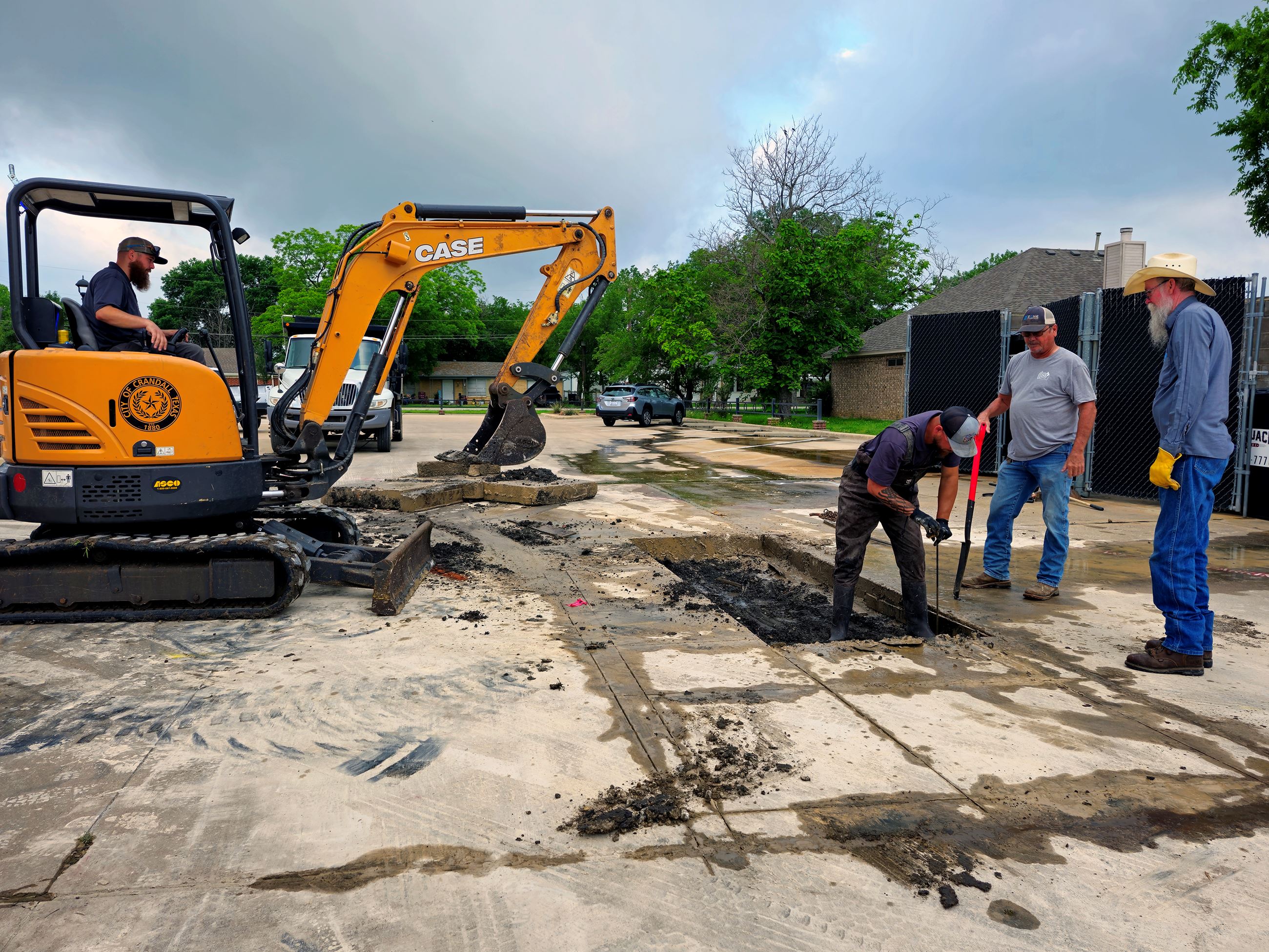 Public Works digging down to repair a water pipe break