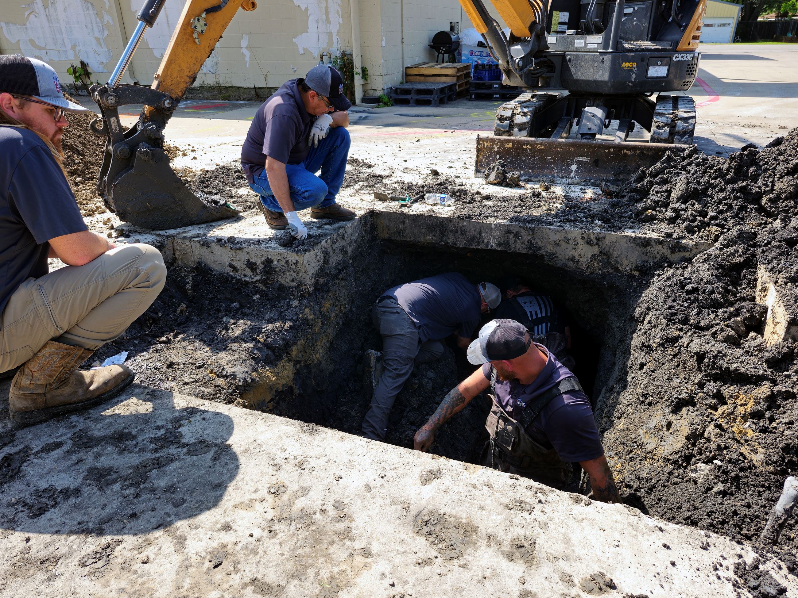 Public Works repair a water break under the parking lot