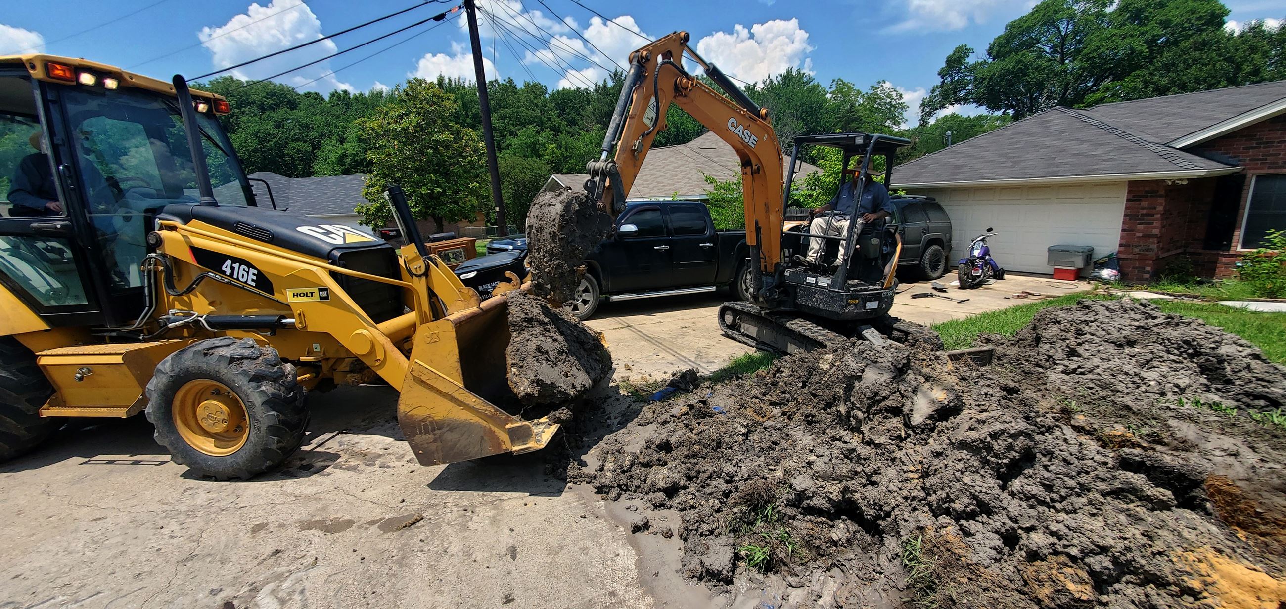 Public Works employees transferring dirt